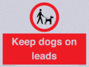 dogs-on-lead-symbol-with-black-text-on-white-background~
